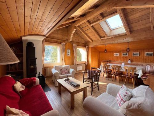 a living room with couches and a dining room at Apartment Peak App- Morgins by Interhome in Morgins