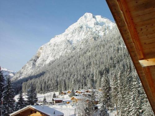 a view of a snowy mountain from a cabin at Apartment Appartement Eggmatte by Interhome in Grimmialp