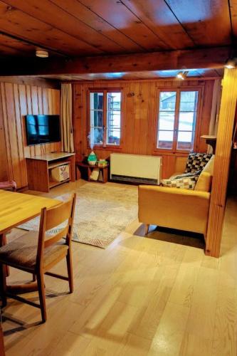 a living room with a bed and a table at Apartment Ferienwohnung by Interhome in Blankenburg