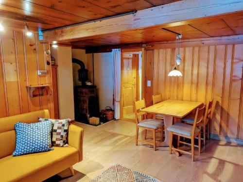 a dining room with a wooden table and chairs at Apartment Ferienwohnung by Interhome in Blankenburg