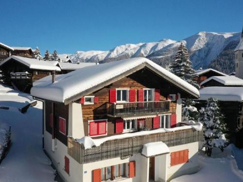 a house with snow on the roof in the snow at Apartment Alter Konsum by Interhome in Bellwald