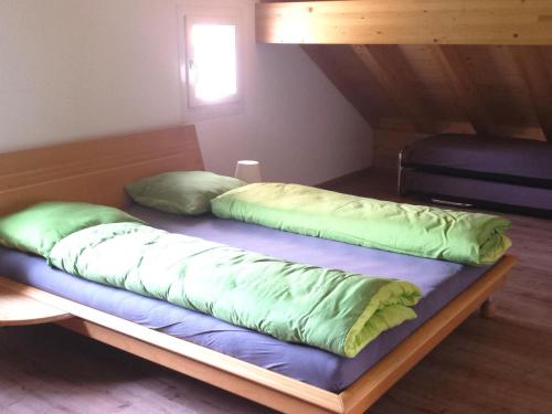 two pillows on a bed in a room at Apartment S'Ottä by Interhome in Sattel