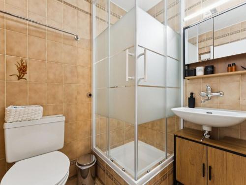 a bathroom with a shower and a toilet and a sink at Apartment Lake View Studio by Interhome in Ingenbohl