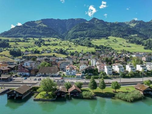 an aerial view of a town with a river and mountains at Holiday Home Verena's B&B by Interhome in Sachseln