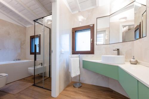 a bathroom with a sink and a mirror at La Vecchia cantina Guzzardi in Lari