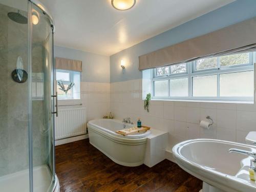 a large bathroom with a tub and a sink at 4 Bed in Hexham oc-90521 in Bardon Mill