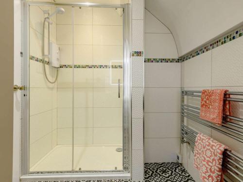 a shower with a glass door in a bathroom at 1 Bed in Wareham oc-88099 in Wool