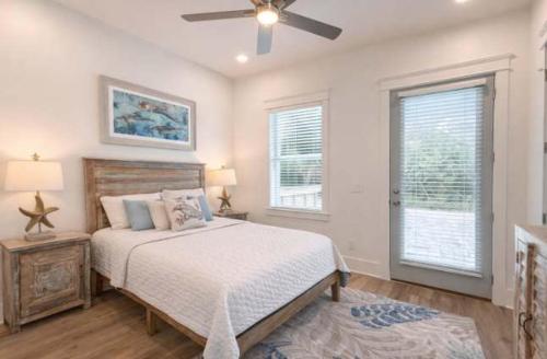 a bedroom with a bed and a ceiling fan at New- Prime Location - Ground Floor Bedroom - Pool in Eastpoint