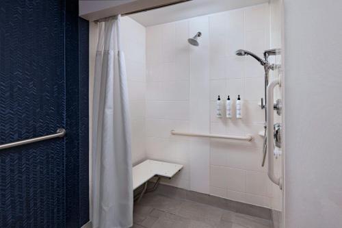 a bathroom with a shower with a shower curtain at Fairfield Inn & Suites by Marriott Edison - South Plainfield in Edison