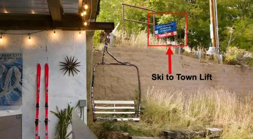 a sign that says sit to town lift on the side of a building at Side-by-Side Homes Multi-level with Views Ski Trail in Park City