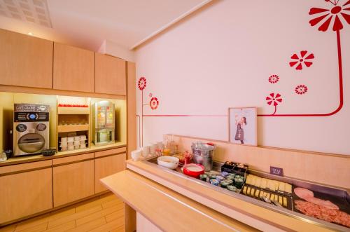 a kitchen with a counter with food on it at Ibis Sarlat Centre in Sarlat-la-Canéda