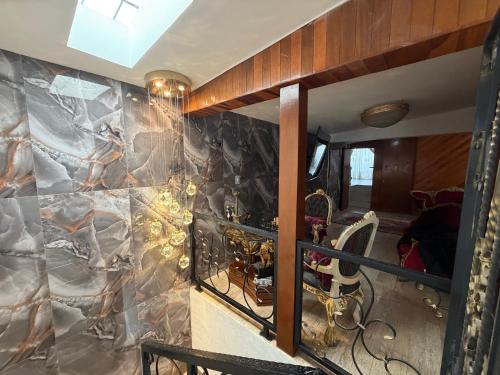 a room with a wall with a stone wall at CasaButique in Mexico City