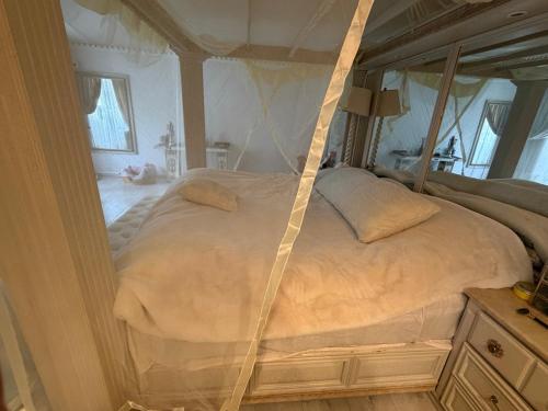 a bedroom with a large bed in a room at CasaButique in Mexico City