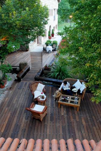 an aerial view of a patio with chairs and tables at Molino de Alcuneza Relais & Châteaux in Sigüenza