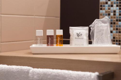 a tray of products on a counter in a bathroom at B&B Villa Seta in Agrigento