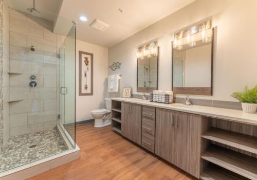 a bathroom with a shower and a sink and a toilet at The Lodge Lake Chelan in Manson