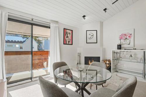 a dining room with a glass table and chairs at Gavilon Aspen Studio in Aspen