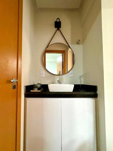 a bathroom with a sink and a mirror at Casa Amaré Barreirinhas in Barreirinhas