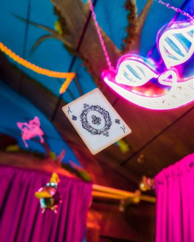 a group of pink and white tags hanging from a ceiling at Stay Portland - Mississippi Micro-Luxe - Mid-Century Style in Piedmont