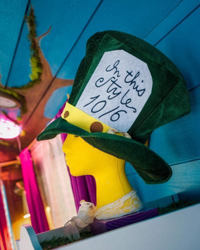 a toy duck wearing a green hat with a sign on it at Stay Portland - Mississippi Micro-Luxe - Mid-Century Style in Piedmont