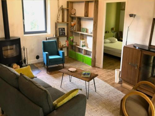 a living room with a couch and a room with a bed at Hilltop Haven in Parlan in Parlan