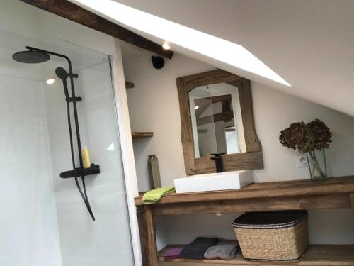 a bathroom with a mirror and a sink at Hilltop Haven in Parlan in Parlan