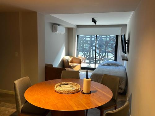 a room with a table with a candle on it at Nogales Apartamentos in Mar del Plata