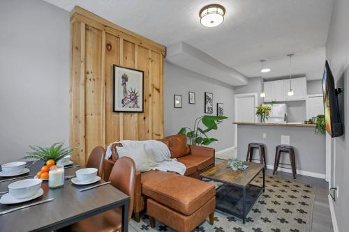 a living room with a couch and a table at Modern Columbus 2BR Near COSI & Arena District in Columbus