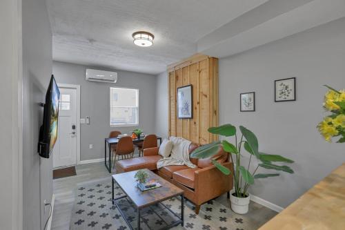 a living room with a couch and a table at Modern Columbus 2BR Near COSI & Arena District in Columbus