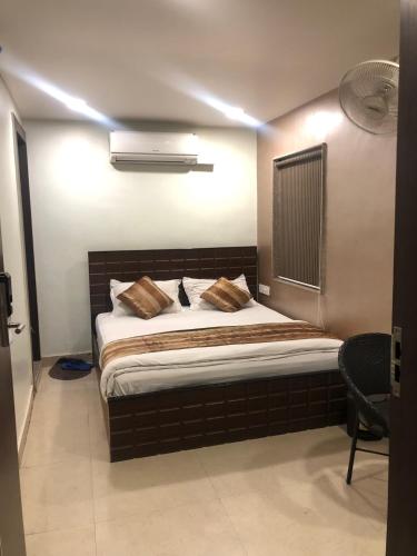 a bedroom with a bed in a room at Hotel Confirm Inn Kota in Kota