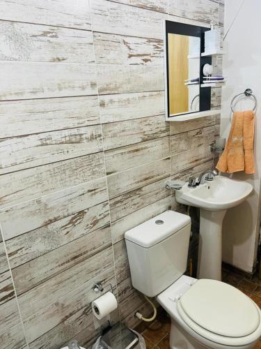a bathroom with a toilet and a sink at El Resguardo in San Luis