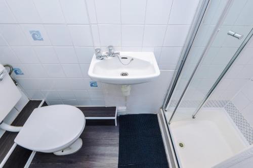 a bathroom with a toilet and a sink at Blackpool Lodge in Blackpool