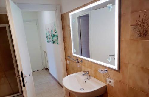 a bathroom with a sink and a mirror at A casa di Ester appartamento in Passo Corese