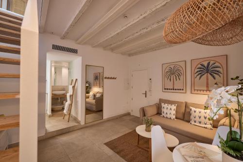 a living room with a couch and a table at Can Savella - Turismo de Interior in Palma de Mallorca