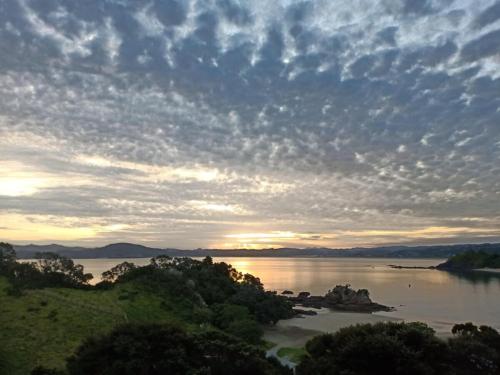 a view of a river with a cloudy sky at W91 Stylish, Modern, Beach view in Tutukaka