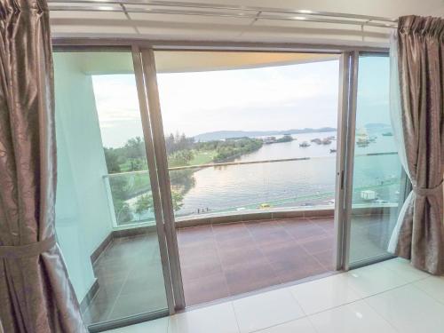 a large window with a view of the water at Luxury Condominium at Loft Imago in Kota Kinabalu