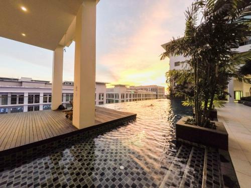 a swimming pool in the middle of a building at Luxury Condominium at Loft Imago in Kota Kinabalu