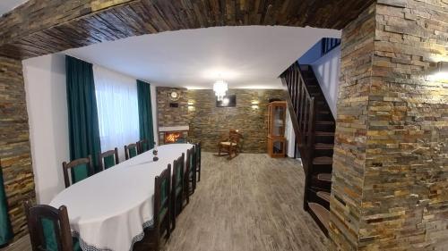 a room with a church with a stone wall at Cabana Codrii Maramuresului in Giuleşti