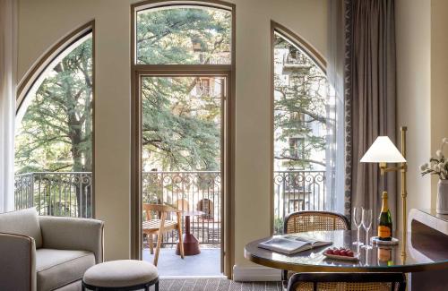 a living room with an open door to a balcony at Mokara Hotel & Spa in San Antonio