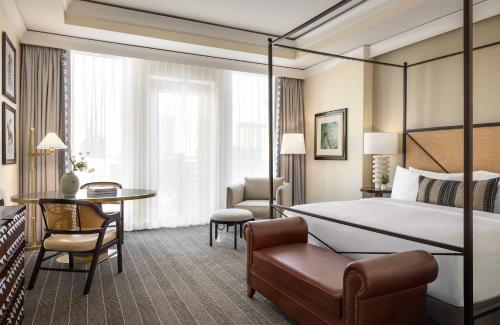 a hotel room with a bed and a desk at Mokara Hotel & Spa in San Antonio