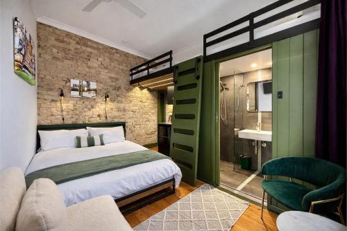 a bedroom with a bed and a green ladder at Balmain Village Retreat AC Free Street Parking City 3km in Sydney