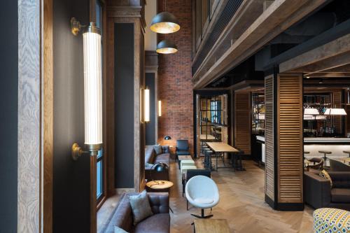 a living room with a couch and a table at The Corner Hotel in Barcelona