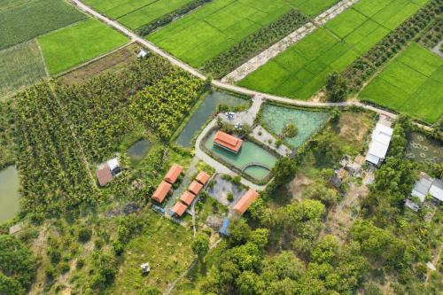 an overhead view of a house in a field at Dream Hill Homestay in Cat Tien