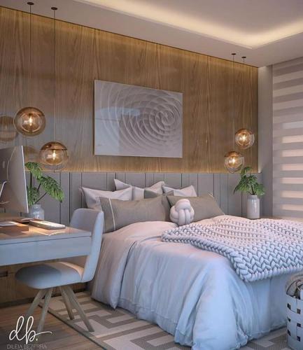 a bedroom with a bed and a desk and a computer at Pousada x in São Paulo