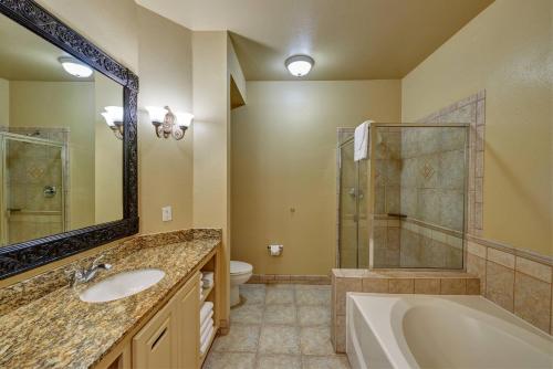 a bathroom with a tub and a sink and a shower at Radisson Hotel El Paso Airport in El Paso