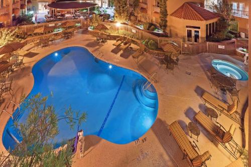an overhead view of a swimming pool at night at Radisson Hotel El Paso Airport in El Paso