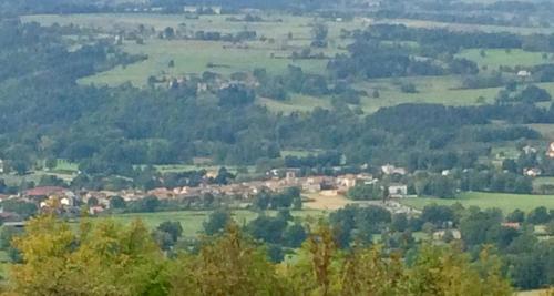 a view of a small town in a valley at Domaine La Reveille in Dore-lʼÉglise