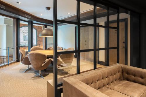 a living room with a couch and a table at The Corner Hotel in Barcelona