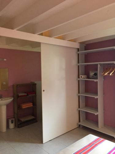 a room with a bunk bed and a sink at Gîtes La Simonière & Cars in Saint-François