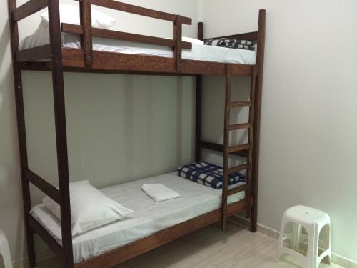 a bedroom with two bunk beds in a room at Hostel Rotor in Ouro Branco